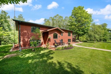 View of front of house with a patio and a front yard