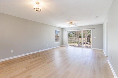 Spare room featuring a ceiling fan, baseboards, li