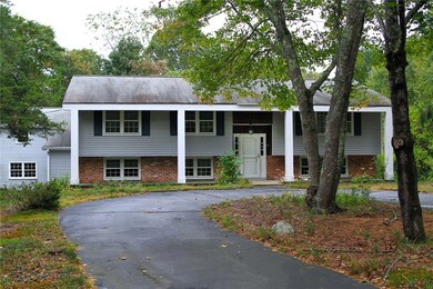 Second driveway to the east of the property leads