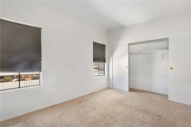Unfurnished bedroom featuring a closet, carpet, an