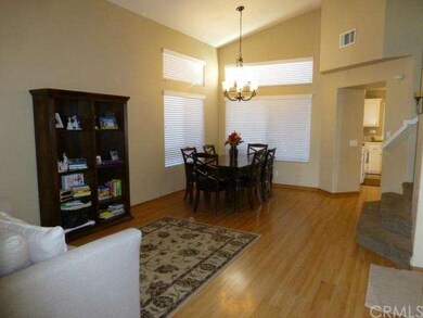 View of the living room and formal dining area.
