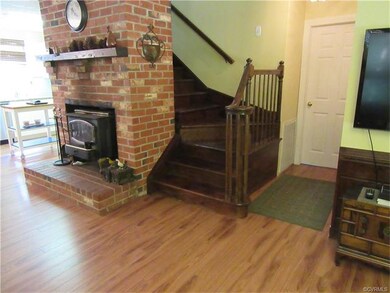 The Foyer that opens to the Living Room has Stairs