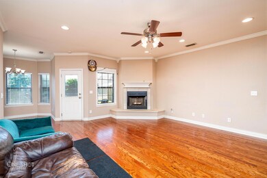 Unfurnished living room with crown molding, ceilin