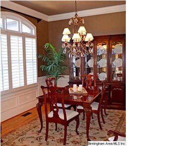 Dining Room has hardwood floors & crown molding & 