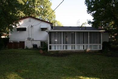 Fenced yard w/ 3 season room.