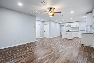 Unfurnished living room with a ceiling fan, wood 