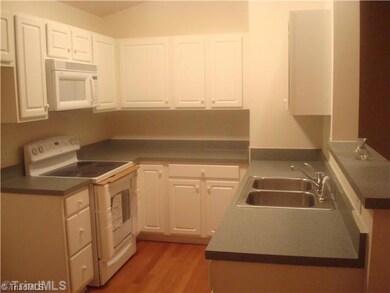 Kitchen. All appliances remain including refrigerator, washer and dryer.