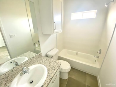 Full bathroom with tile patterned flooring, vanity, bathtub / shower combination, and toilet