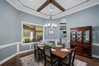 Notice the tray ceilings with wood beams , chair r