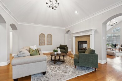 The front living area exudes charm with rich hardw