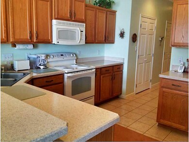 Kitchen. Kitchen features ceramic tile flooring, b