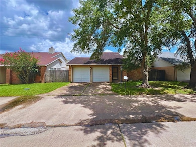 Single-story brick house with a two-car garage and