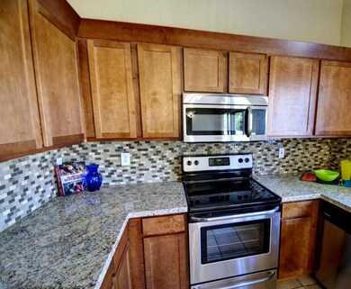 New Granite Counters & Tiled Backsplash