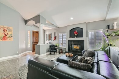 Living area featuring baseboards, granite finish f