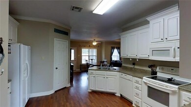 KITCHEN (LOOK AT ALL THAT CABINET SPACE)