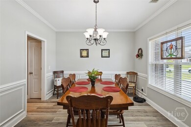 Immediately on the right is a formal dining room w