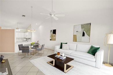 Virtually Staged Living room with a ceiling fan, light tile patterned flooring, baseboards, and high vaulted ceiling