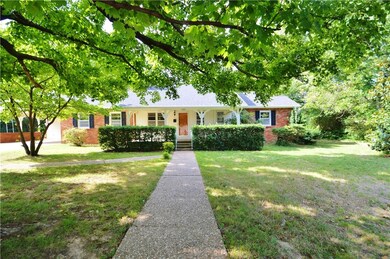 Front of home.  Covered porch with swing is behind
