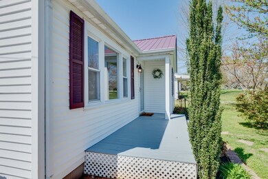 Large Front Porch - Covered at Doorway.....nice landscaping!  Home has been freshly painted inside and out! 