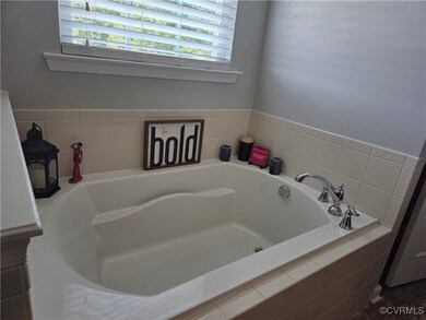 Full bathroom with a garden tub