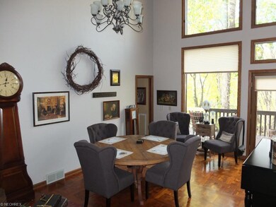 2 story formal dining room is open to the great ro