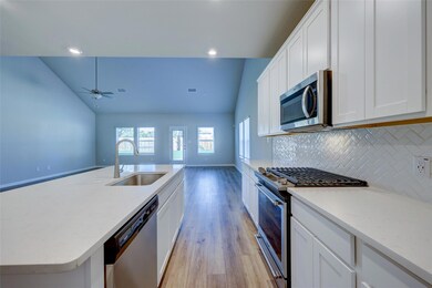 Kitchen featuring appliances with stainless steel