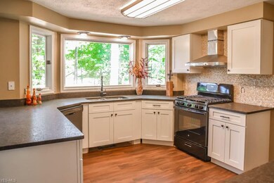 The kitchen comes applianced with a dishwasher and