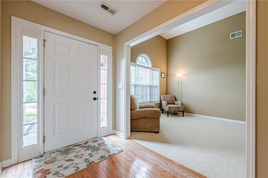 Foyer featuring baseboards and light wood-style flooring