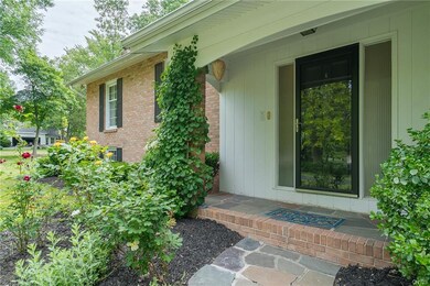 Front exterior entrance door leading to white marb