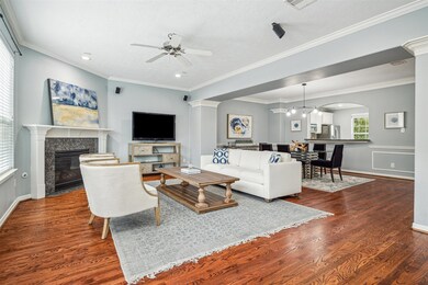 The living, dining, and kitchen seamlessly flow to