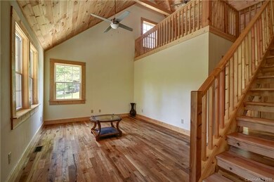 Living Area of Great Room, Stairs to Loft and Loft overlooking the Great Room