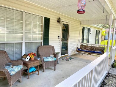 Front porch with a swing!  Low maintenance home fe