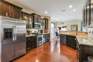 Exquisite custom kitchen with tile backsplash, car