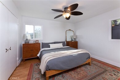 Large master bedroom with ample room for furniture.