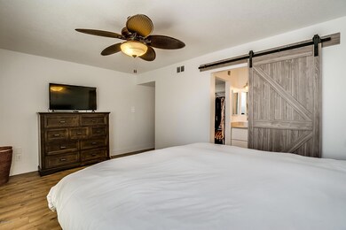 Master has barn door at bathroom entry
