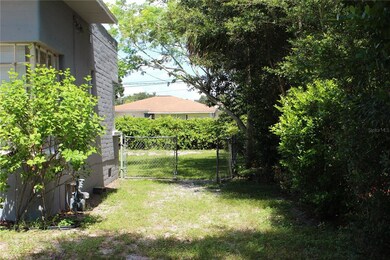 Fence Leading to Back Yard on Right Side of House