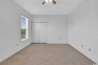 Unfurnished bedroom with ceiling fan, a closet, an