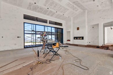Living area featuring high vaulted ceiling and sliding doors for total indoor and outdoor entertaining. Views of the entire valley from the back deck.