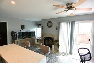 BREAKFAST BAR AND SLIDING GLASS DOORS LEADING TO B