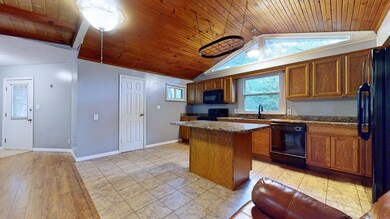The kitchen is open to the great room and has a va