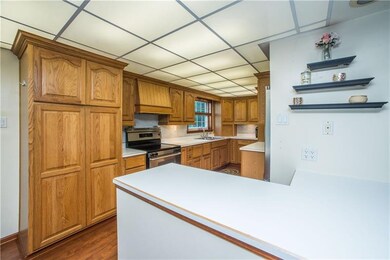 A peninsula between the living and kitchen area of