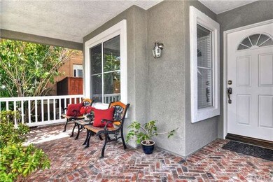 Custom red brick hardscape on the quaint front por