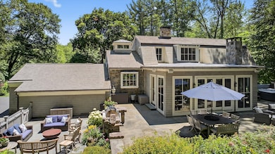 Multi-tiered patios, cedar shake and copper gutters and a copper roof.