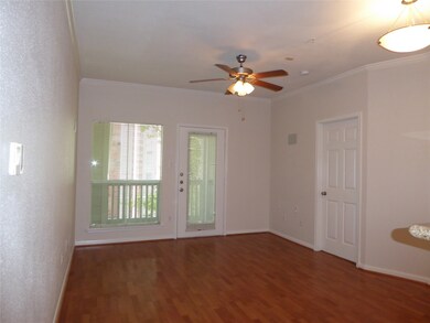 Living/Dining Area with Wood Floors and Balcony Ov