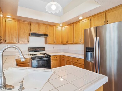 Kitchen with stainless steel fridge, under cabinet