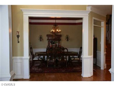 Dining Room - Perfect and spacious dining room for your dinner parties! The tray ceiling with crown molding and picture frame wainscoting enhances its  beauty. Open amd bright !
