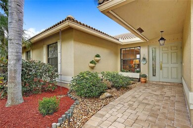 Wide, covered, paver entry with garden and bubbly fountain.  Front of house has impact windows and steel front door.