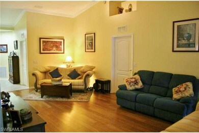 Living area to entry way showing crown molding
