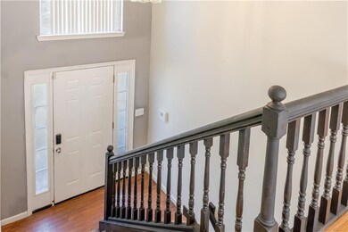Foyer entrance featuring wood finished floors