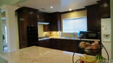 Rich dark wood custom cabinets, gorgeous back spla